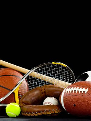 Misc. Sports equipment on a black background with copy space above